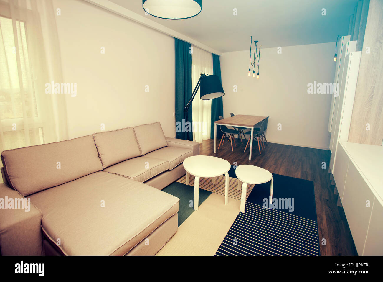 Cozy and bright living room with sofa and furniture Stock Photo - Alamy