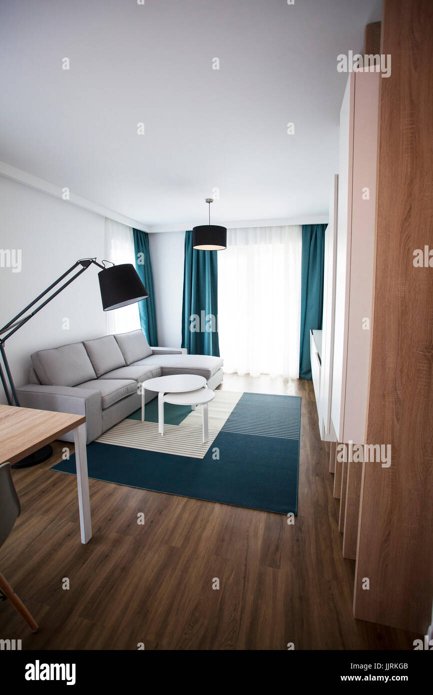 Cozy and bright living room with sofa and furniture Stock Photo - Alamy