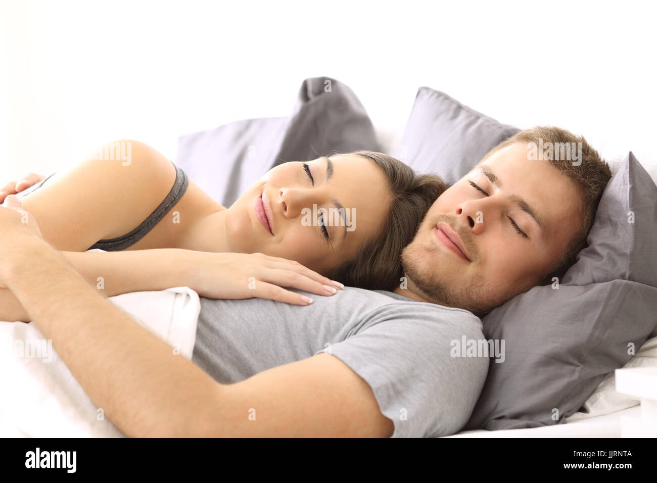 Happy couple in love sleeping together at home Stock Photo - Alamy