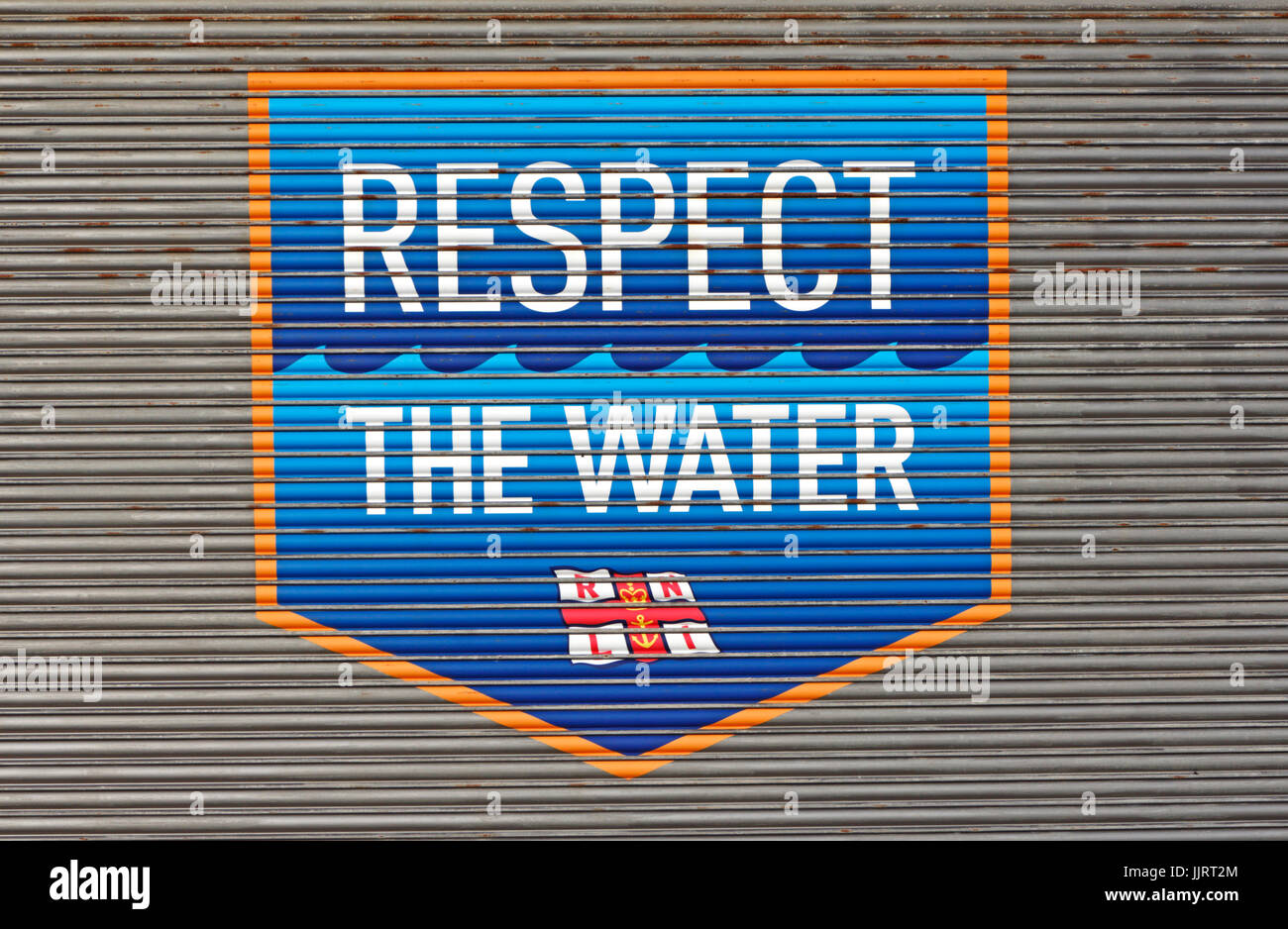 Respect The Water sign on the Happisburgh Lifeboat Station door at Cart Gap Road, Happisburgh, Norfolk, England, United Kingdom. Stock Photo