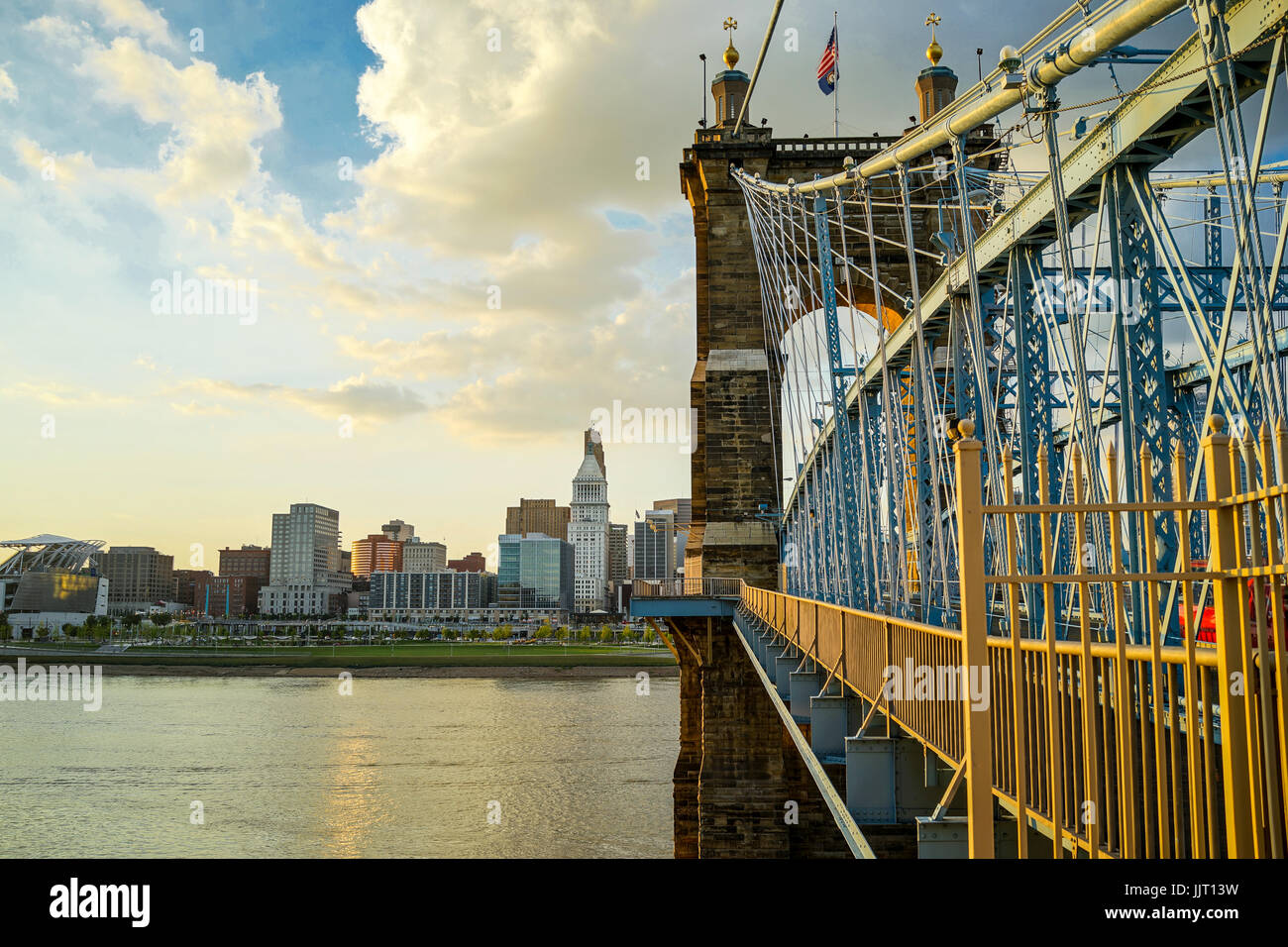John A. Roebling Suspension Bridge with sunset and clouds at Cincinnati, Ohio. Stock Photo