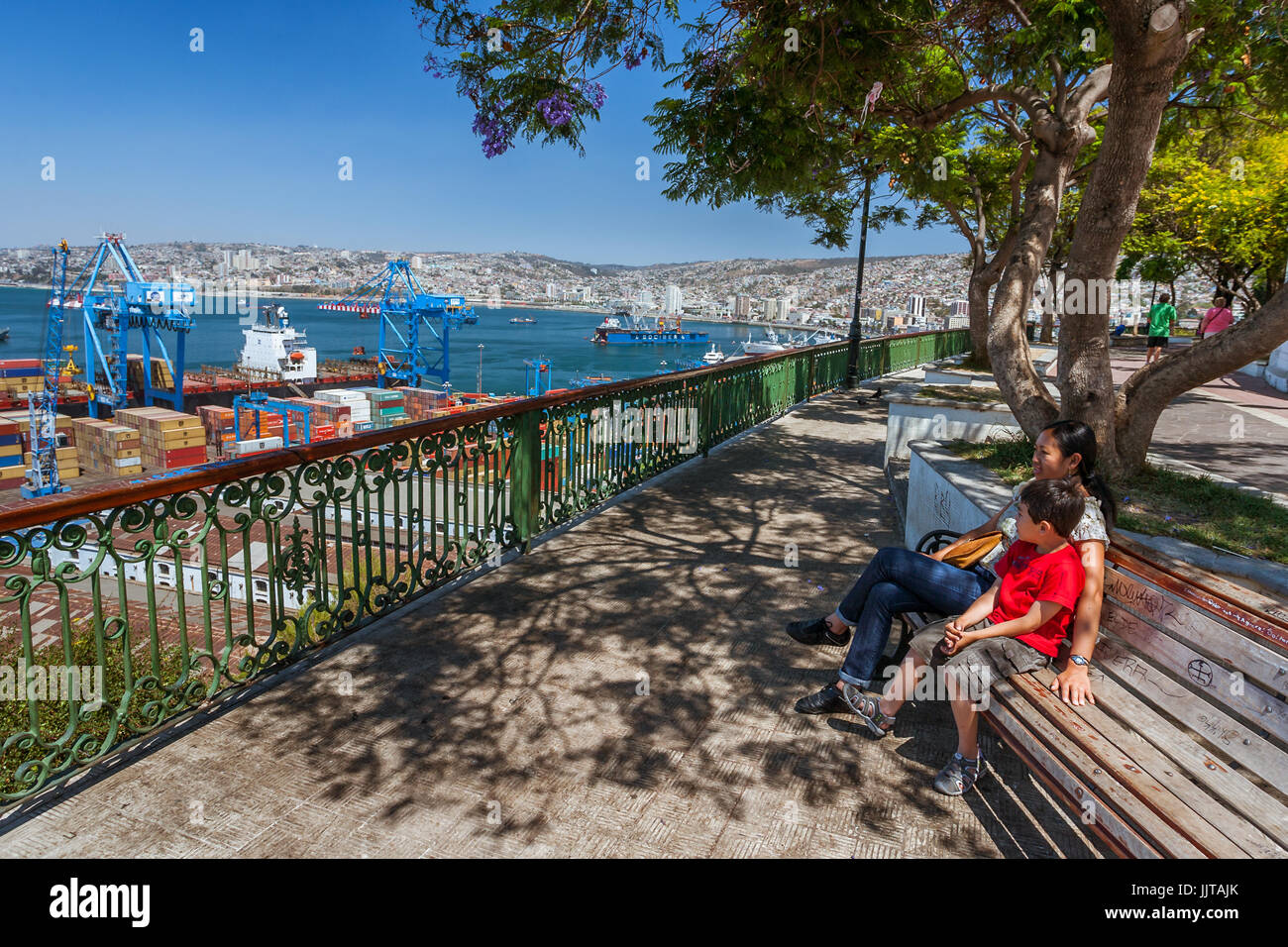 Valparaiso, Chile, January 11, 2017:  Tourists looking at view on the port of Valparaiso from Paseo Artilleria. Stock Photo
