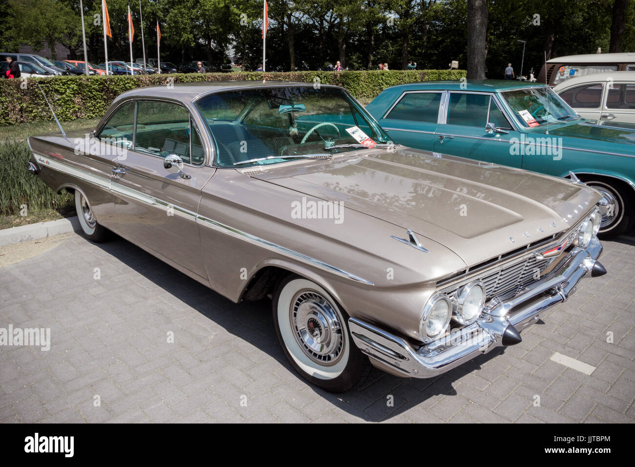 DEN BOSCH, THE NETHERLANDS - MAY 10, 2015: Brown 1961 Chevrolet Impala Coupe classic car. Stock Photo
