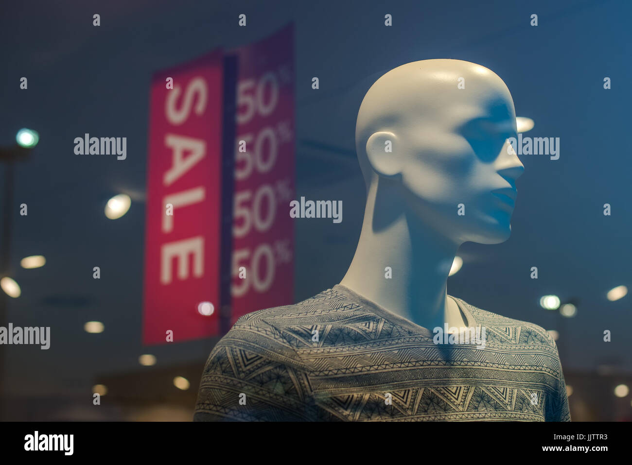 Shopping mall boutique mannequin with clothes on sale, male figure