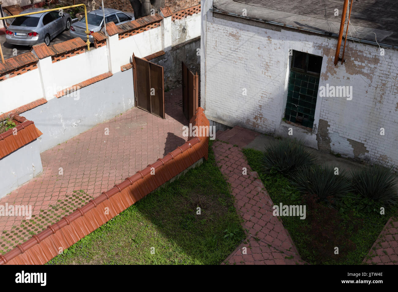 Gate in the abandoned house. Centre of the old city. Stock Photo