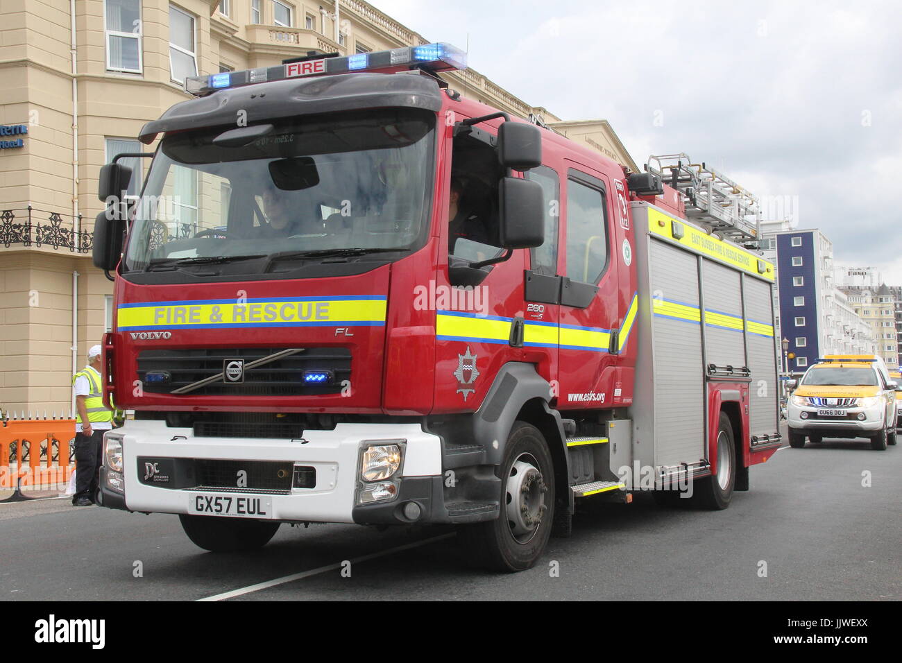 EAST SUSSEX FIRE & RESCUE VOLVO FIRE APPLIANCE WITH BLUE LIGHTS FLASHING Stock Photo