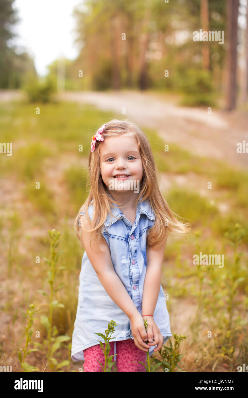 Happy girl in a summer park Stock Photo - Alamy