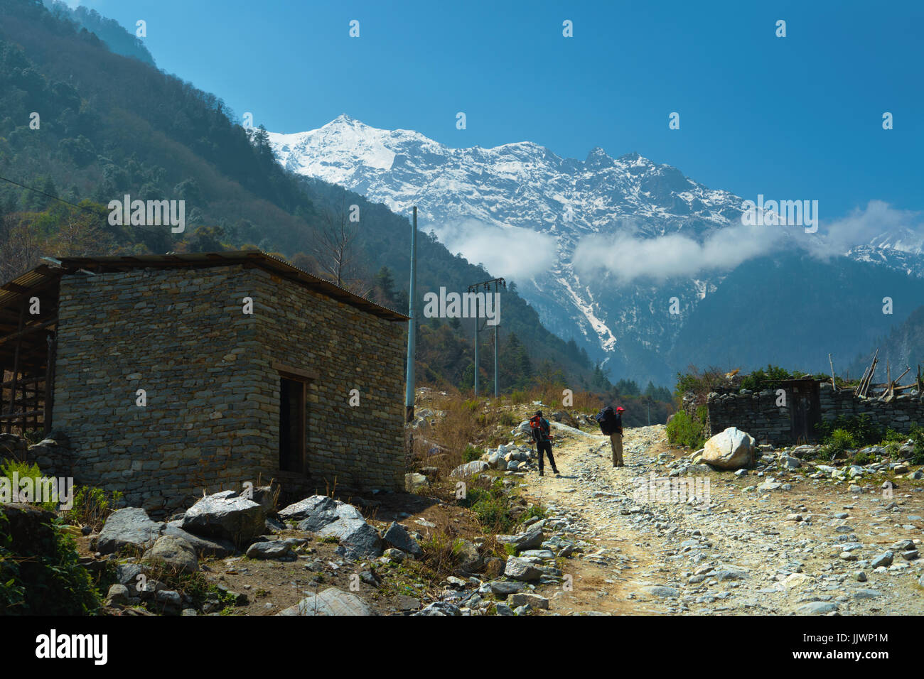 Trekking trail going through the village of Bagarchhap, Annapurna region, Nepal. Stock Photo