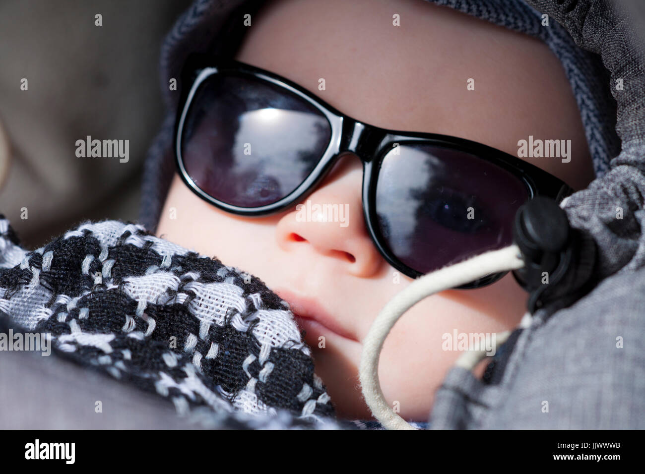 A three month old baby wearing sunglasses Stock Photo Alamy