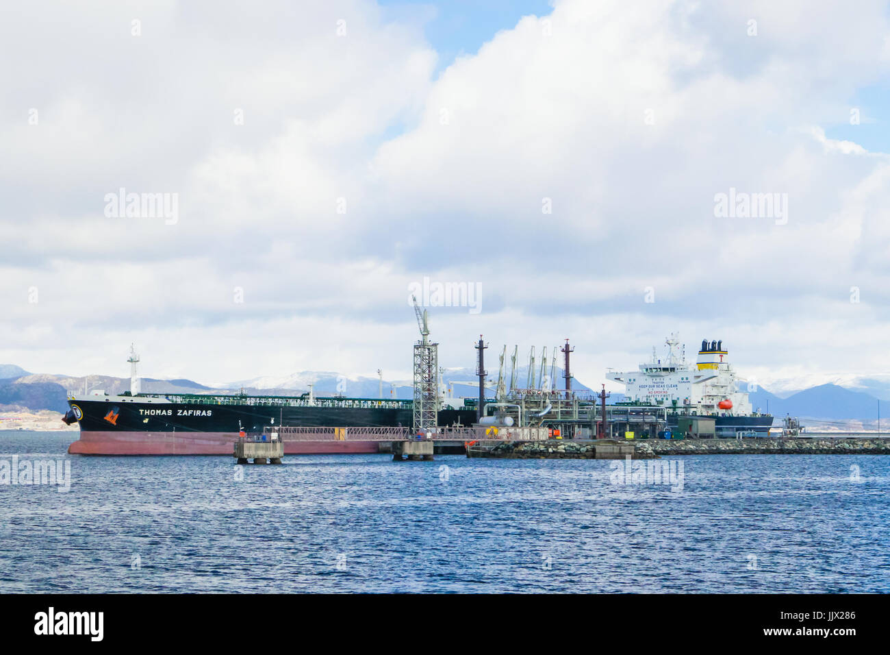MONGSTAD, NORWAY - APRIL 22, 2017: Crude oil tranker Thomas Zafiras unloading at the Statoil Mongstad production facility. Stock Photo