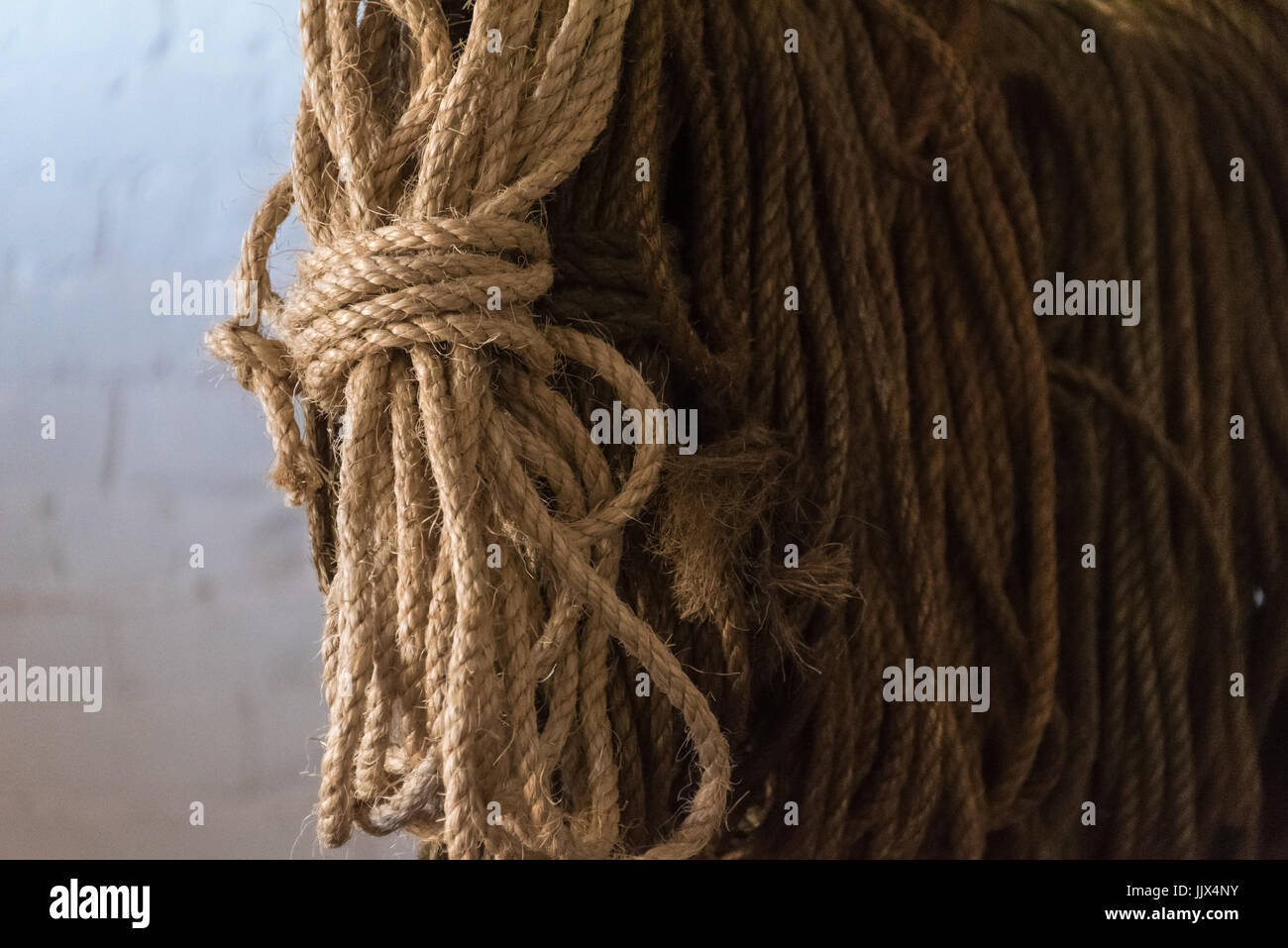 Rope hangs in a supply room at historic 19th century Fort Clinch on Amelia Island In Fernandina Beach, Florida, USA. Stock Photo