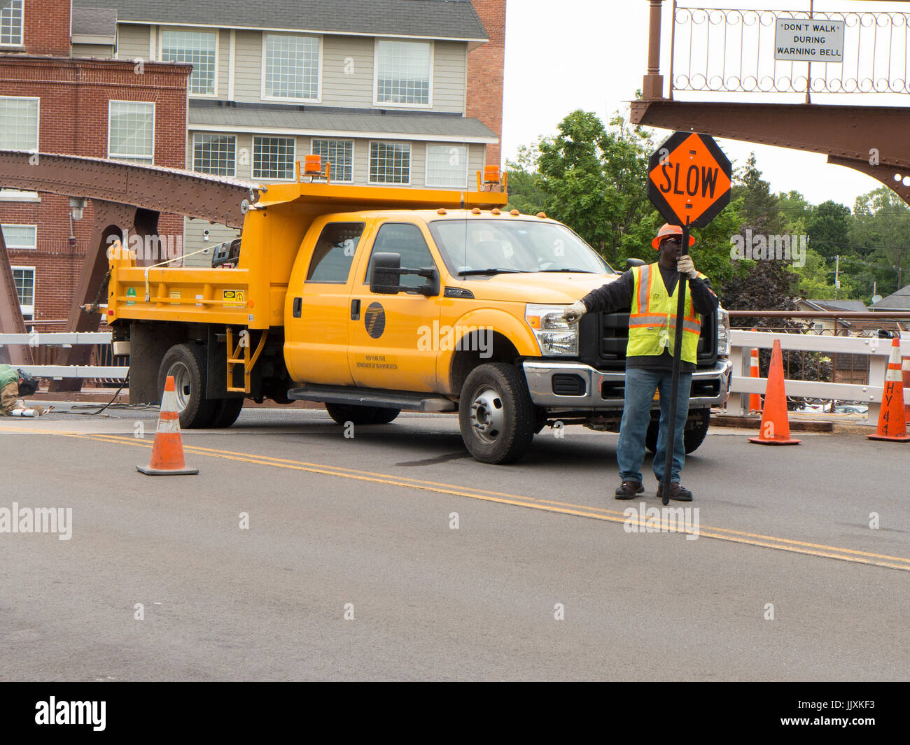 Man directing traffic on lift bridge, Fairport NY USA. Stock Photo