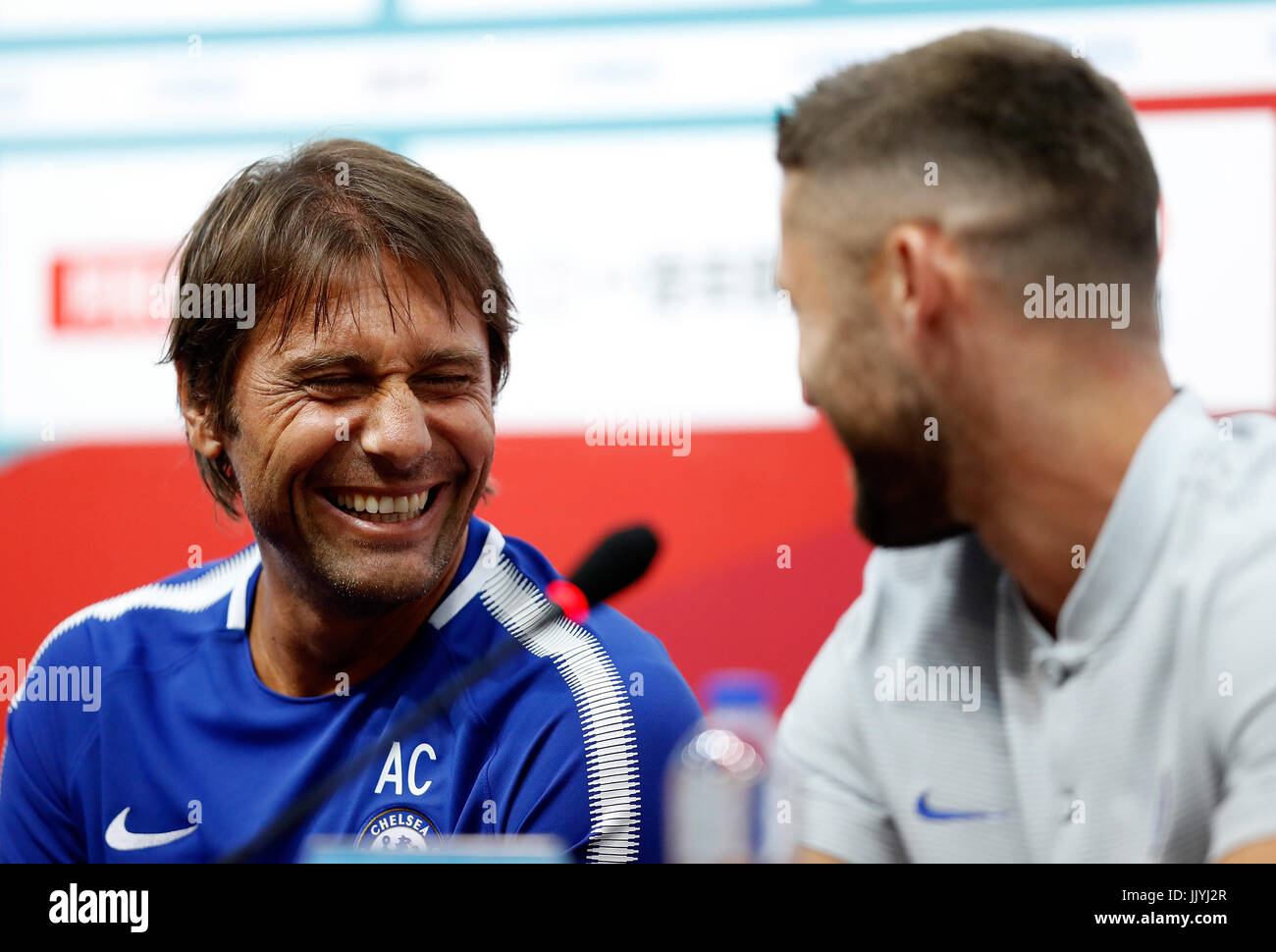 Beijing, China. 21st July, 2017. Antonio Conte (L), manager of Chelsea talks with his player Gary Cahill during a press conference for the pre-season soccer match between Arsenal and Chelsea at National Stadium in Beijing, capital of China, on July 21, 2017. Credit: Xinhua/Alamy Live News Stock Photo