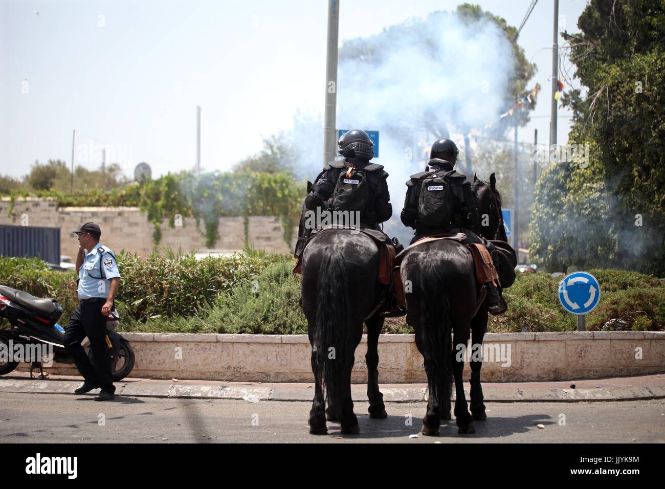 Jerusalem, Jerusalem, Palestinian Territory. 20th Aug, 2017. Horse mounted Israeli security forces patrol during clashes with Palestinian protesters following Friday prayer outside Jerusalem's Old City on July 21, 2017, after Israeli police barred men under 50 from entering the Old City for Friday Muslim prayers as tensions rose and protests erupted over new security measures at the highly sensitive Al-Aqsa mosque compound. The ban came after Israeli ministers decided not to order the removal of metal detectors erected at entrances to the Al-Aqsa mosque compound, known to Jews as the Temple Stock Photo