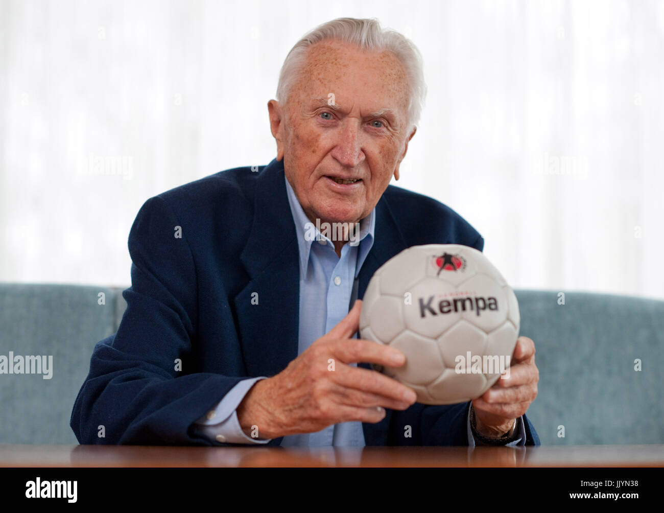 Bad Boll, Germany. 15th Nov, 2010. ARCHIVE - Bernhard Kempa holds a hand  ball in his hands at his house in Bad Boll, Germany, 15 November 2010. The  German handball legend has