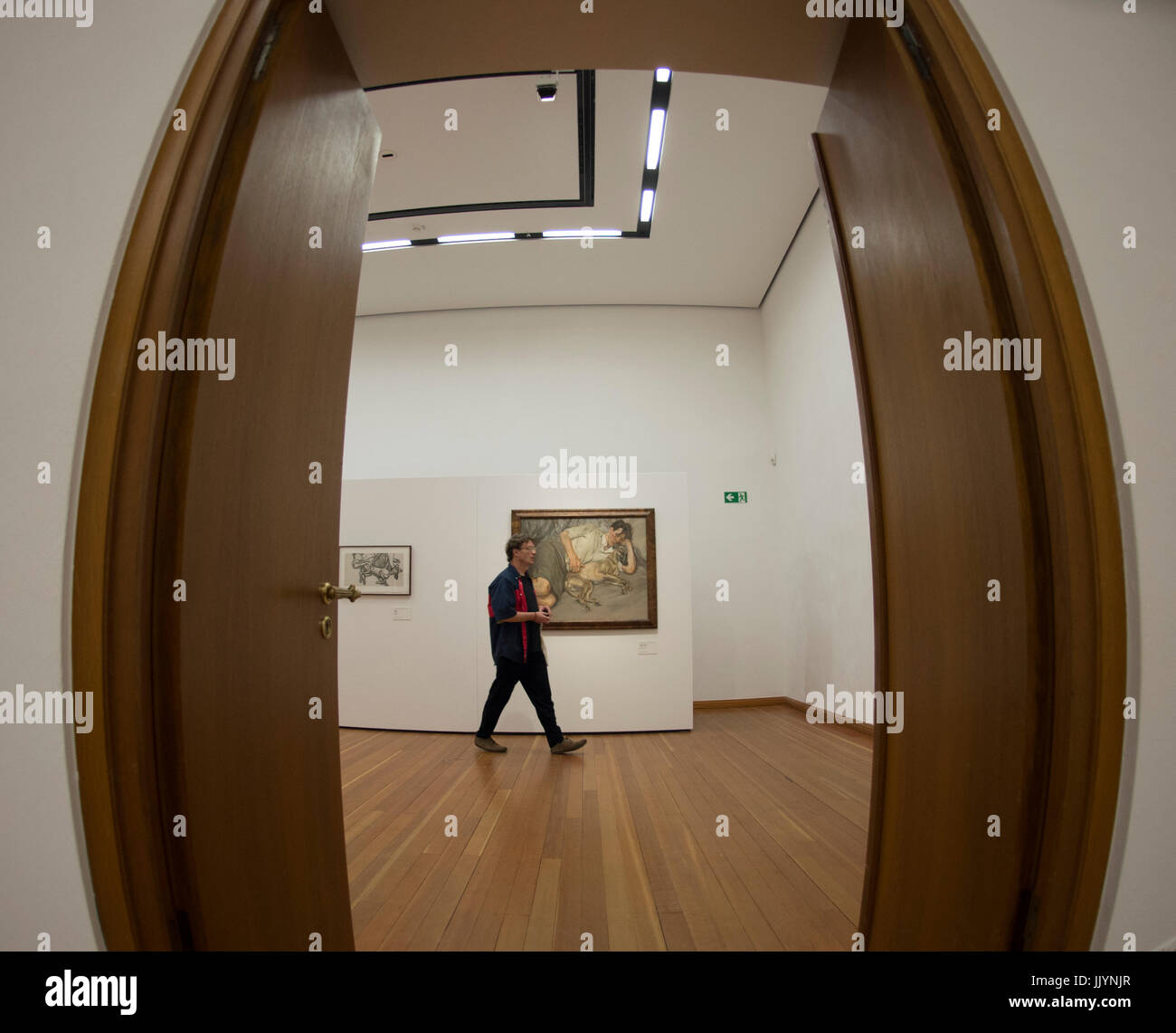 Berlin, Germany. 21st July, 2017. A man walks past works of Lucian Freud in Berlin, Germany, 21 July 2017. The Martin Gropius Bau is showing works of Freud in the exhibition 'Closer Radierungen aus der UBS Art Collection' from the 22nd of July 2017 onwards. Photo: Paul Zinken/dpa/Alamy Live News Stock Photo