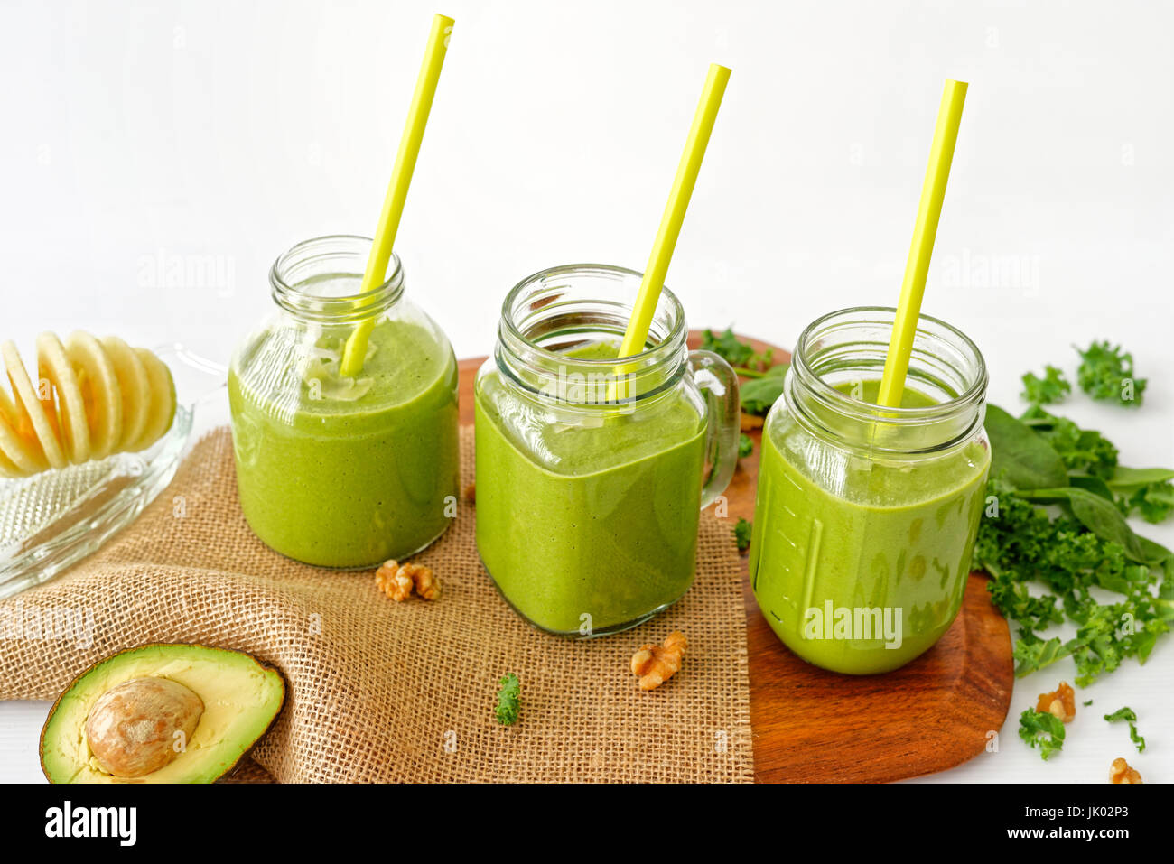 Vegan Kale and Avocado juice with spinach, apple and walnut Stock Photo Alamy