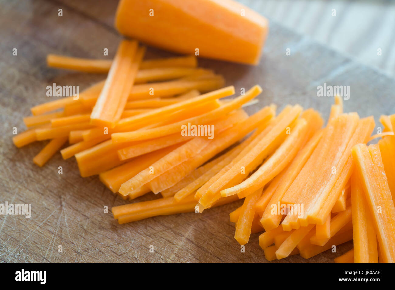 chopped carrot  on wooden board selective focus Stock Photo