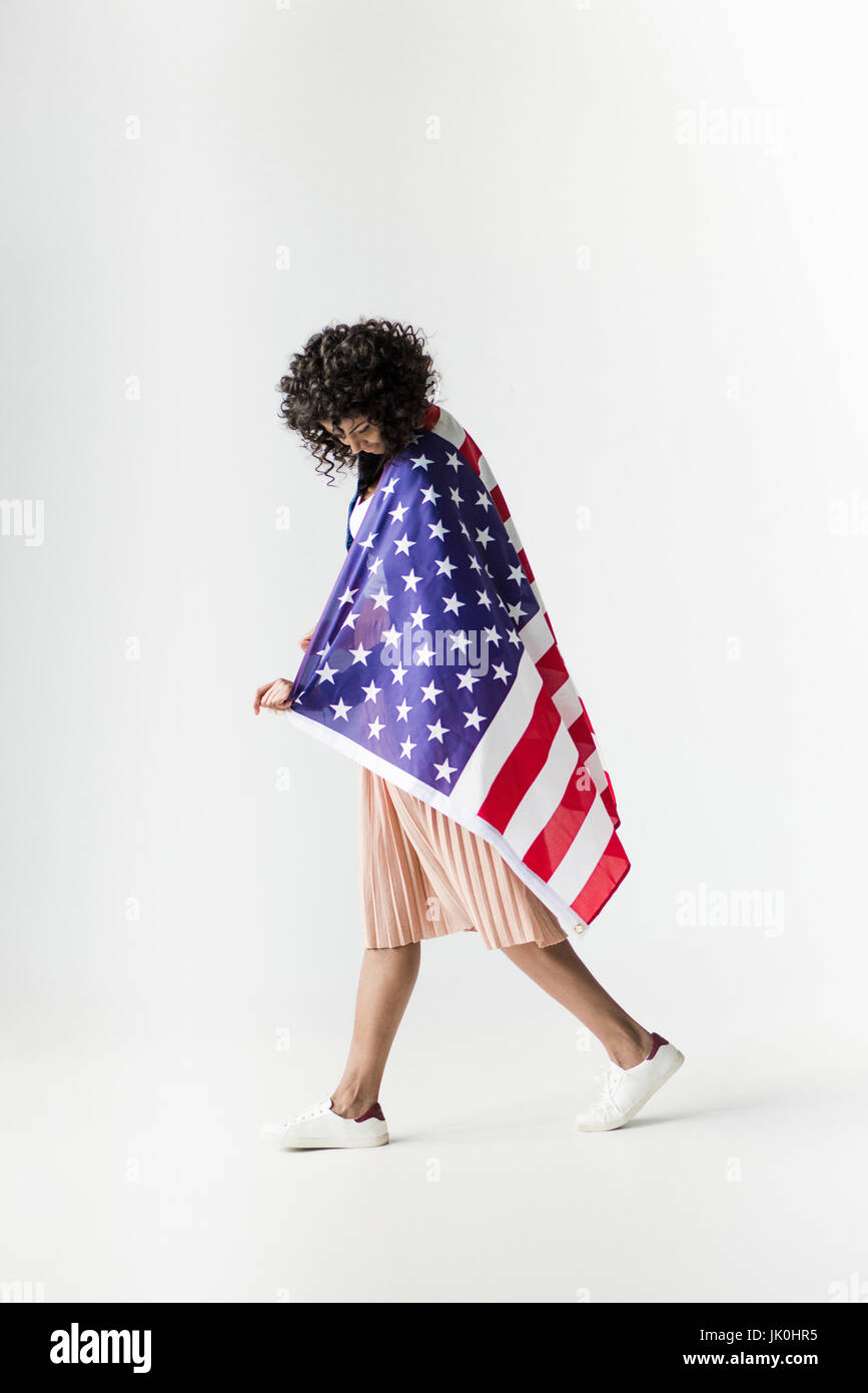 Cute african american woman cowered with american flag Stock Photo