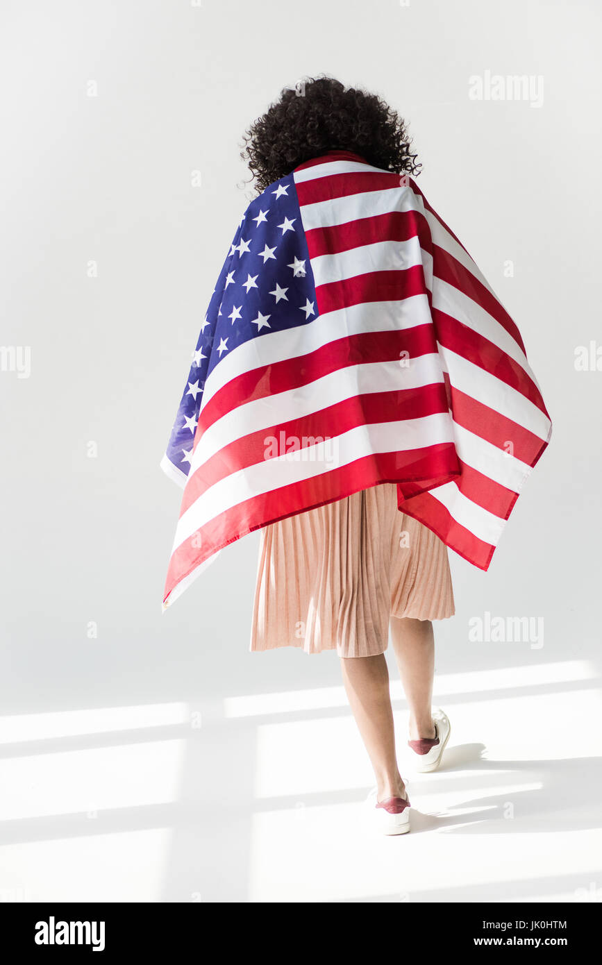 Cute african american woman cowered with american flag Stock Photo