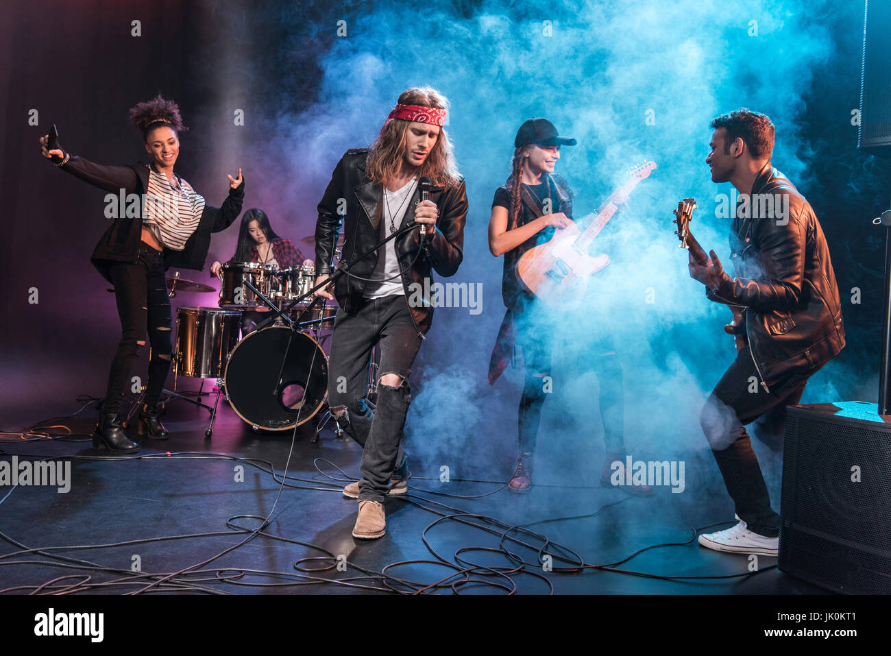 Roll Rode Singer Handsome singer with rock and roll band performing music on stage Stock ...