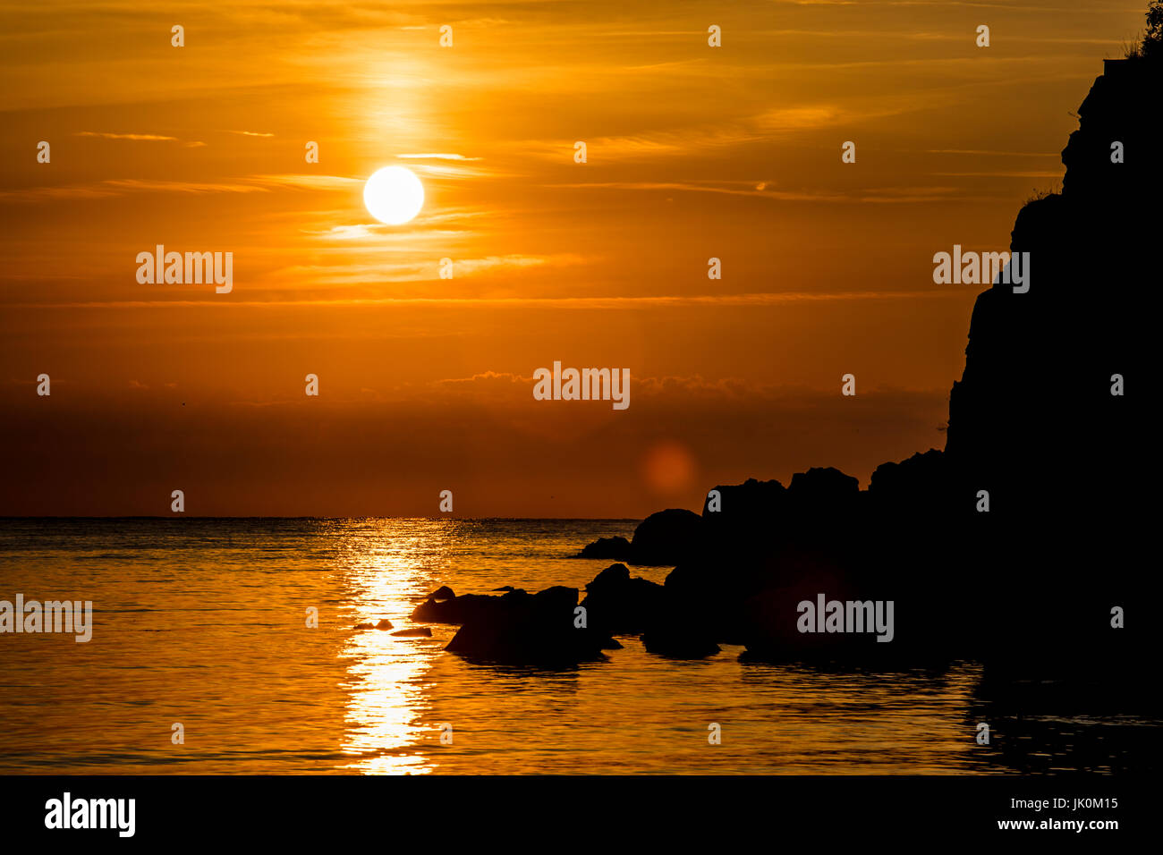 Sunrise at a sea coast Stock Photo