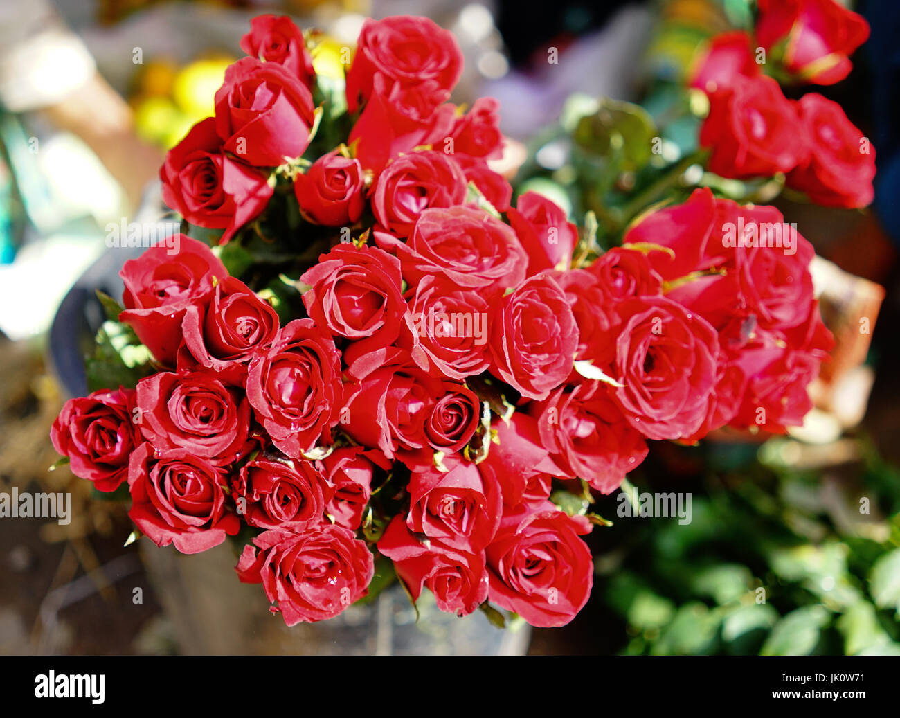 Red roses for sale at the rural market in Yangon, Myanmar Stock Photo Alamy