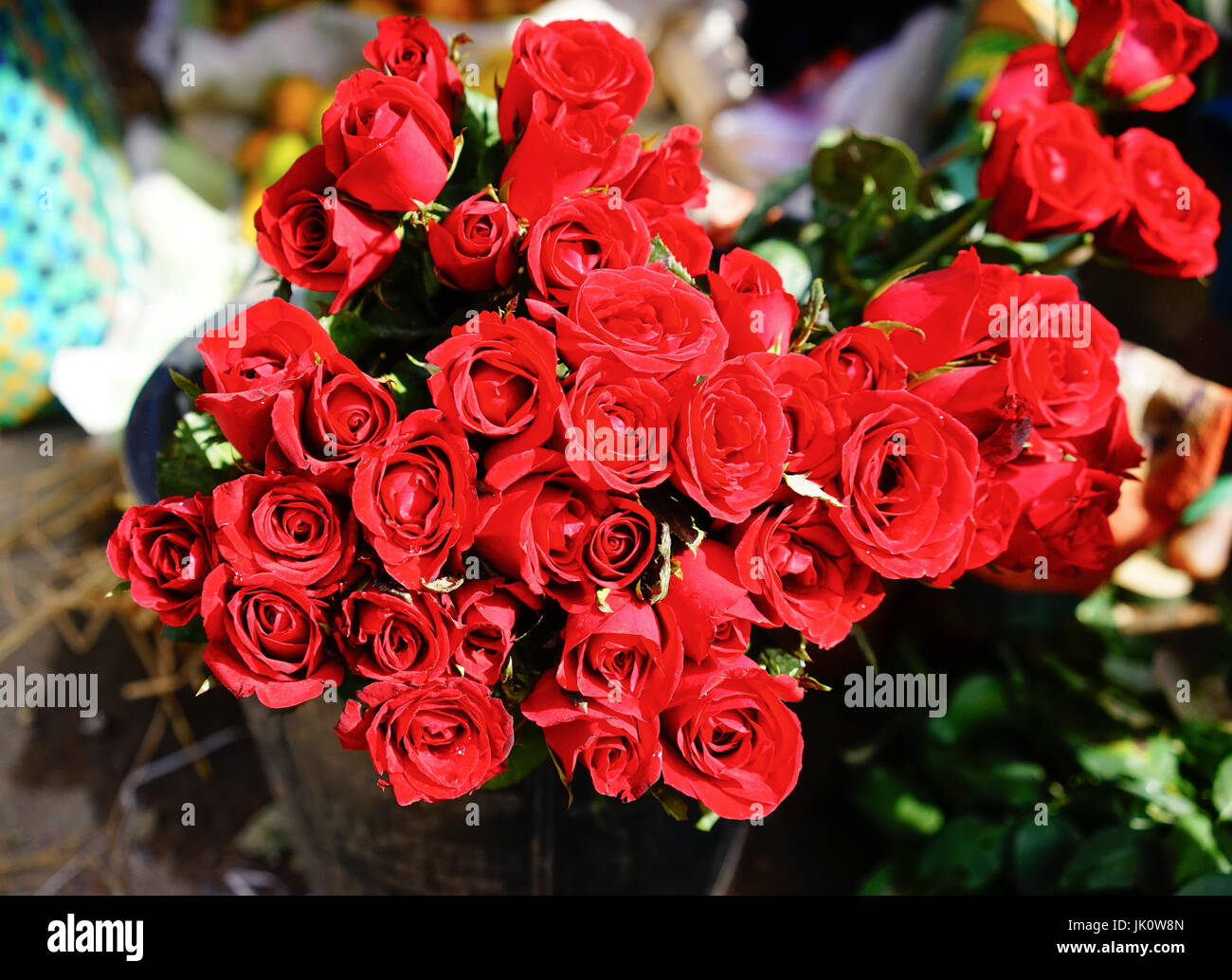 Red roses for sale at the rural market in Yangon, Myanmar Stock Photo