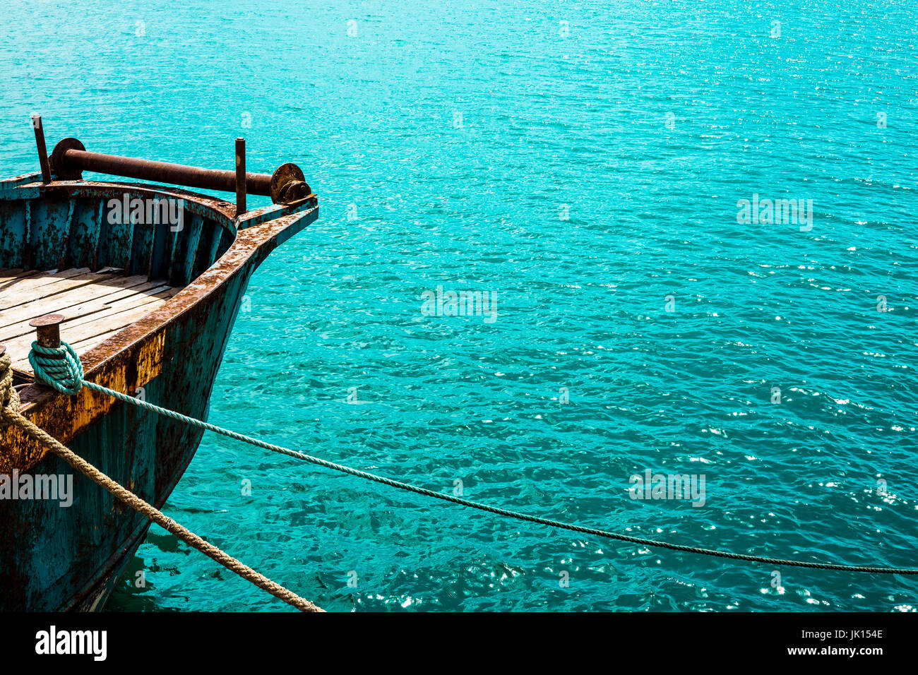 Old ship at a clear blue sea Stock Photo