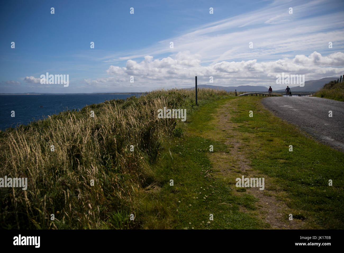 Walking the coastal road, The Wild Atlantic Way, Mullaghmore Head, County Sligo, Ireland Stock Photo