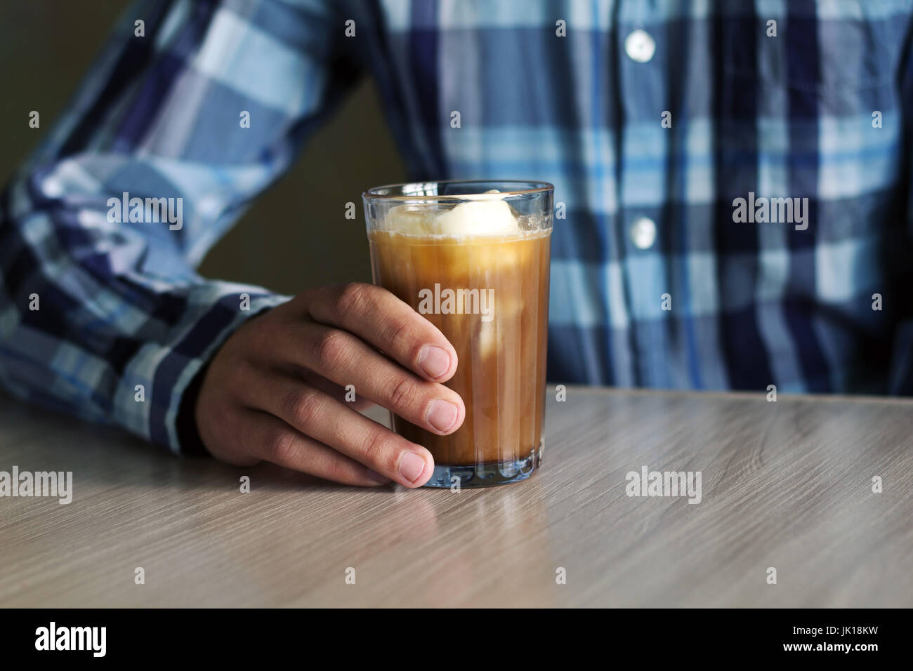 man with iced coffee at the coffee shop Stock Photo
