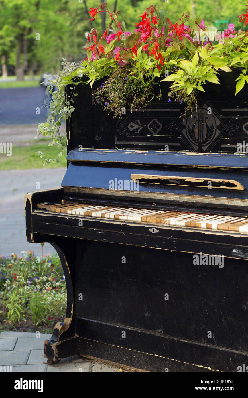 landscape design - using of the old piano as beds. Stock Photo