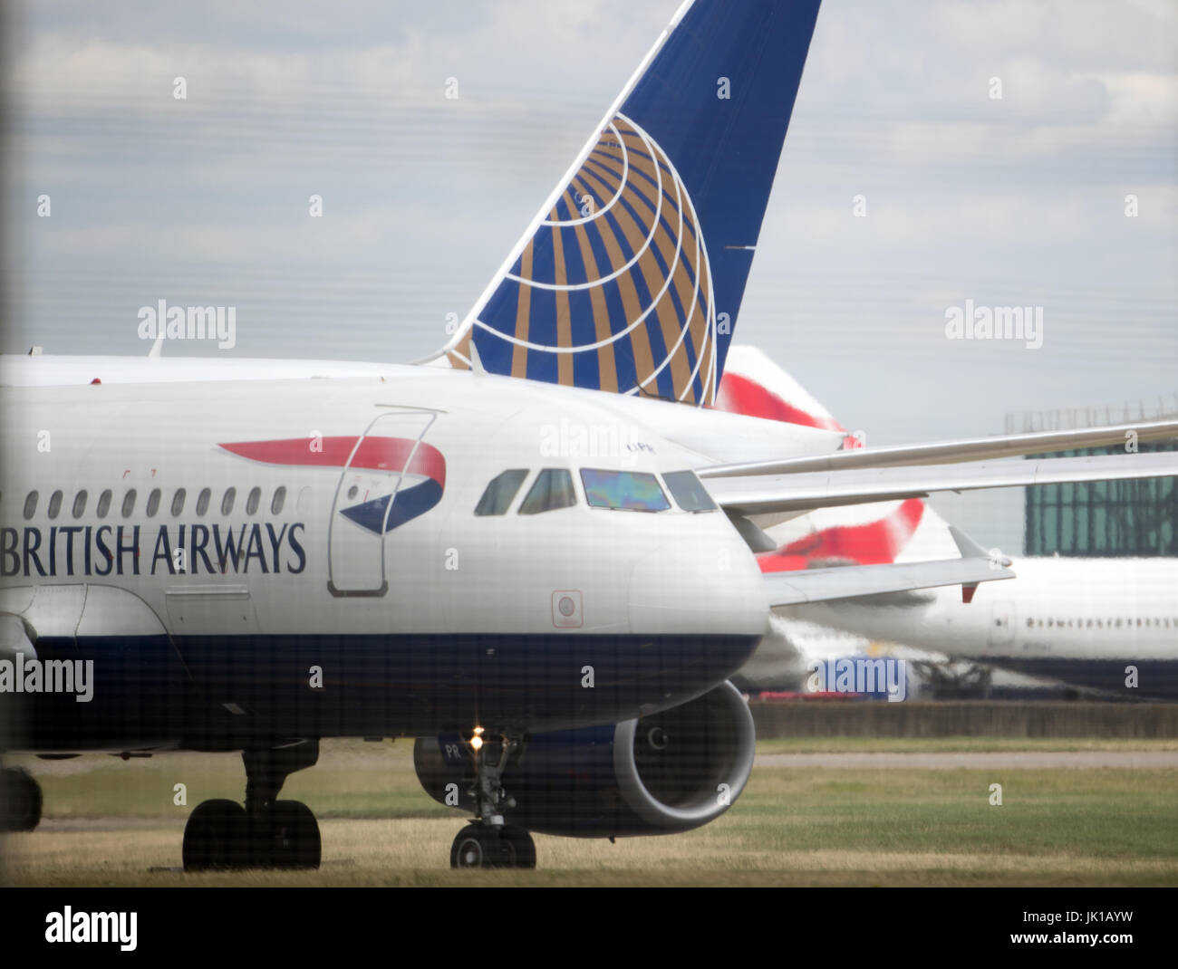 British Airways and United Airlines planes on the tarmac at London's Heathrow airport on the day when air traffic controllers are expected to handle a total of 8,800 planes across the country over 24 hours, making it the busiest day in UK aviation history. Stock Photo