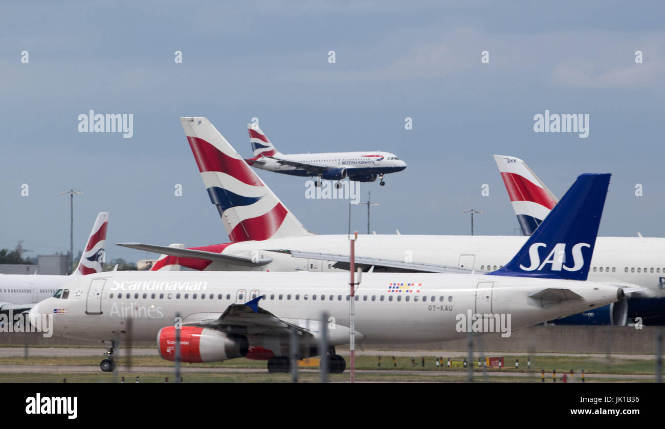Aircraft at London's Heathrow airport on the day when air traffic controllers are expected to handle a total of 8,800 planes across the country over 24 hours, making it the busiest day in UK aviation history. Stock Photo