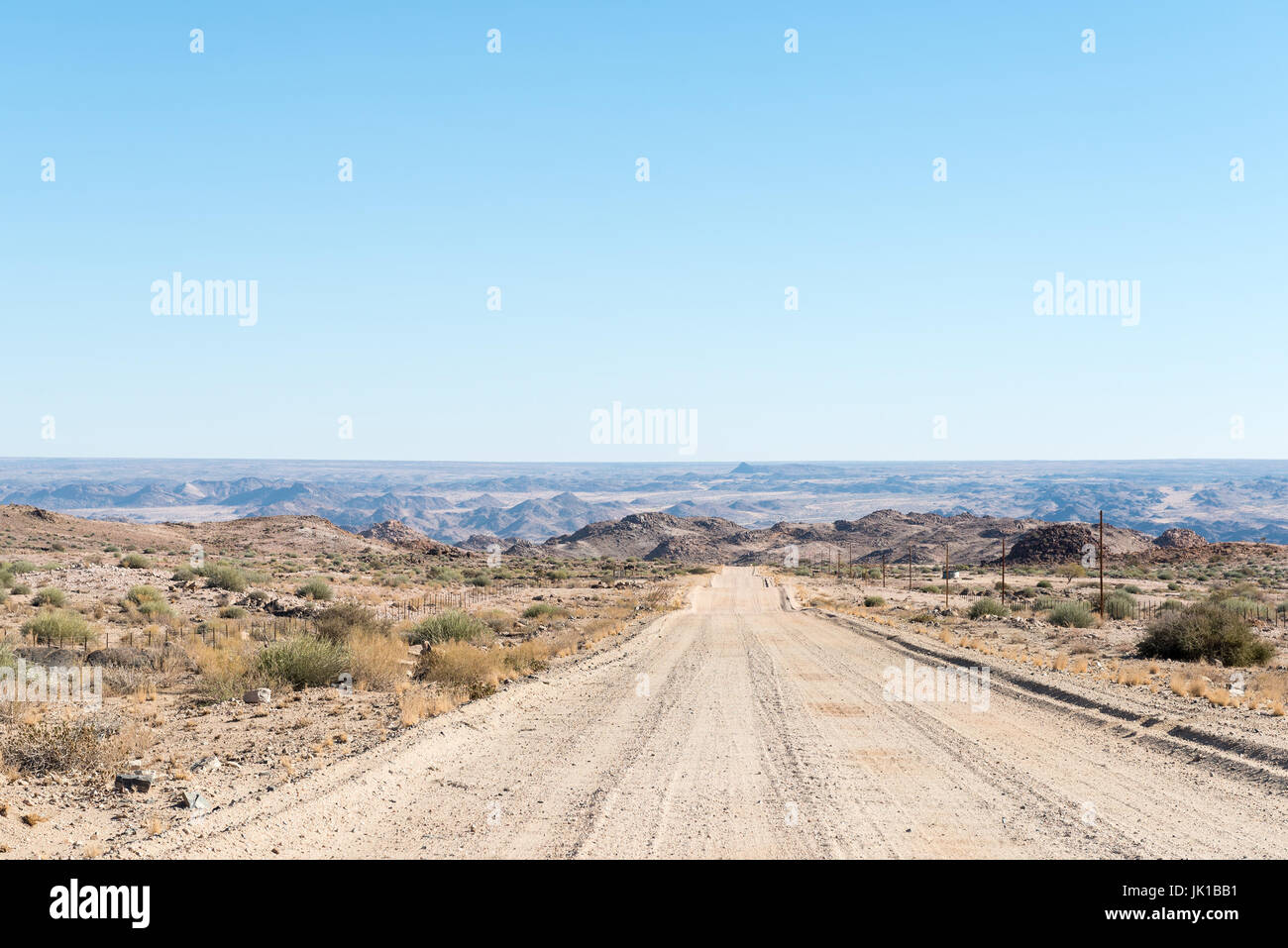 The road from the N14-road past KaXu Solar One to the Onseepkans border post. Namibia is in the distance Stock Photo