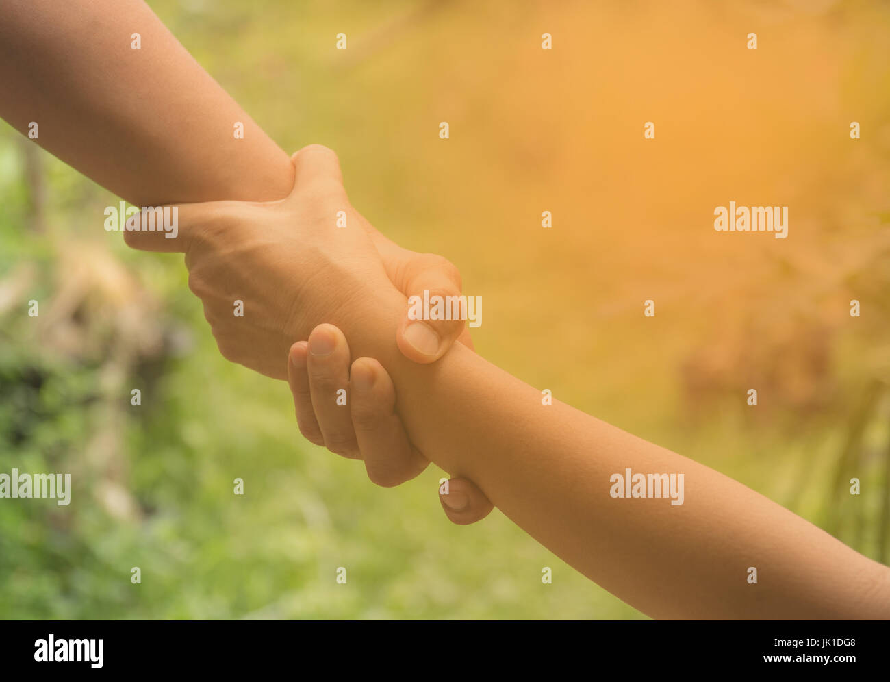 Two pairs of hand touch together, helping hands concept. Helping hand outstretched for help. Stock Photo