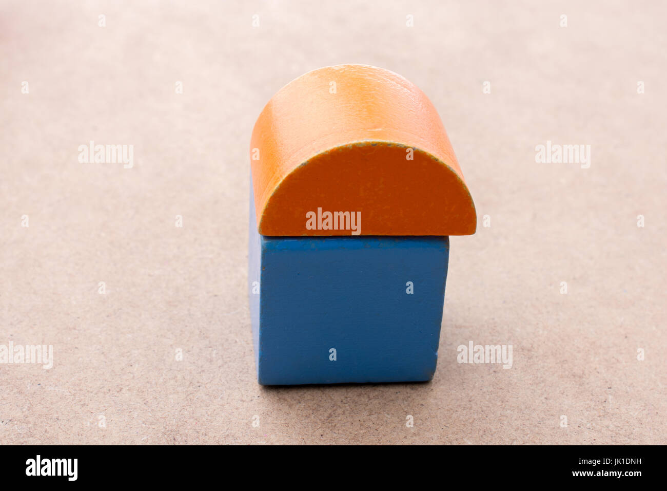 Colorful building blocks on a brown background Stock Photo - Alamy