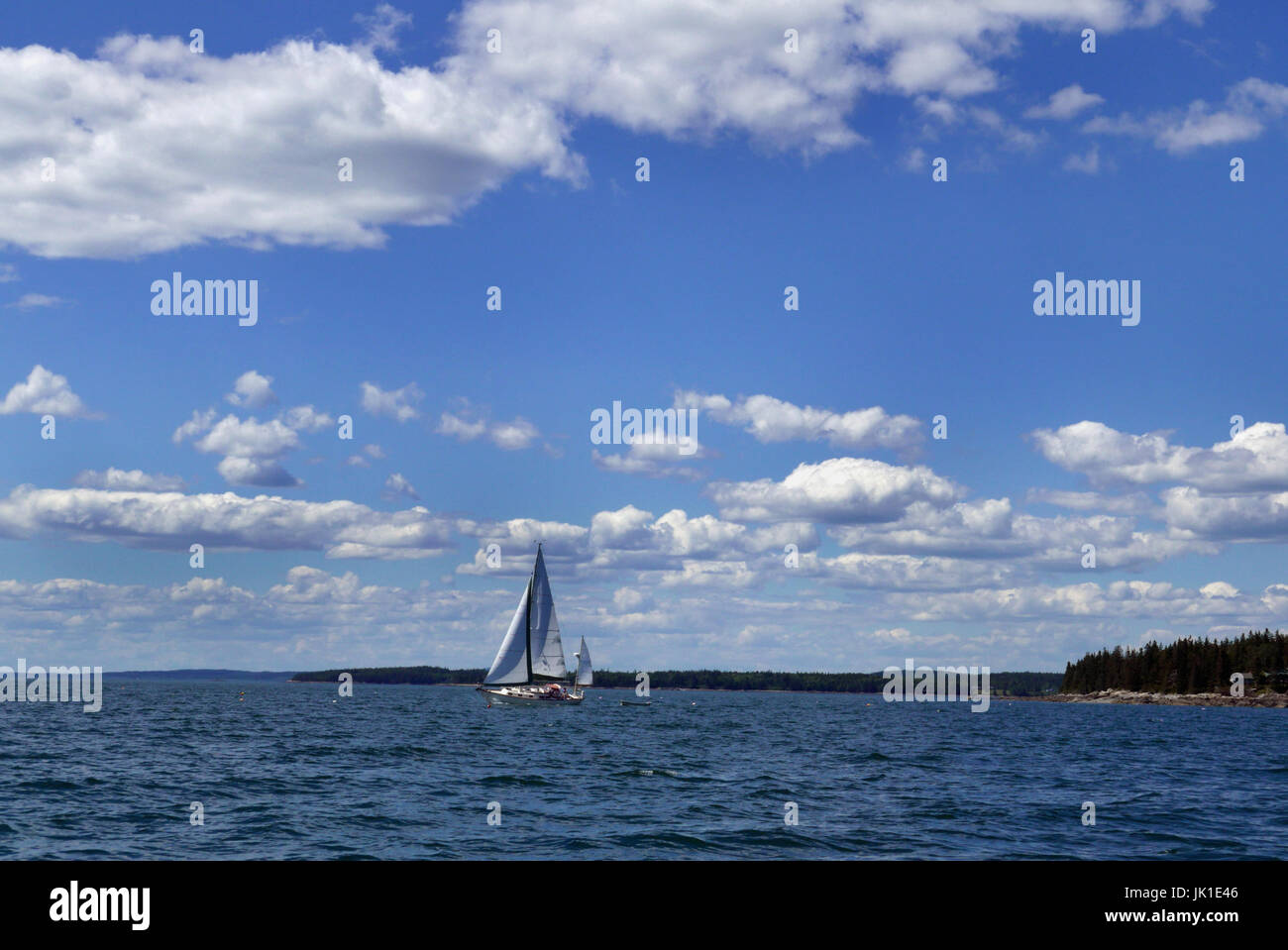 A sailboat in the waters off of Mr Desert Island Maine Stock Photo