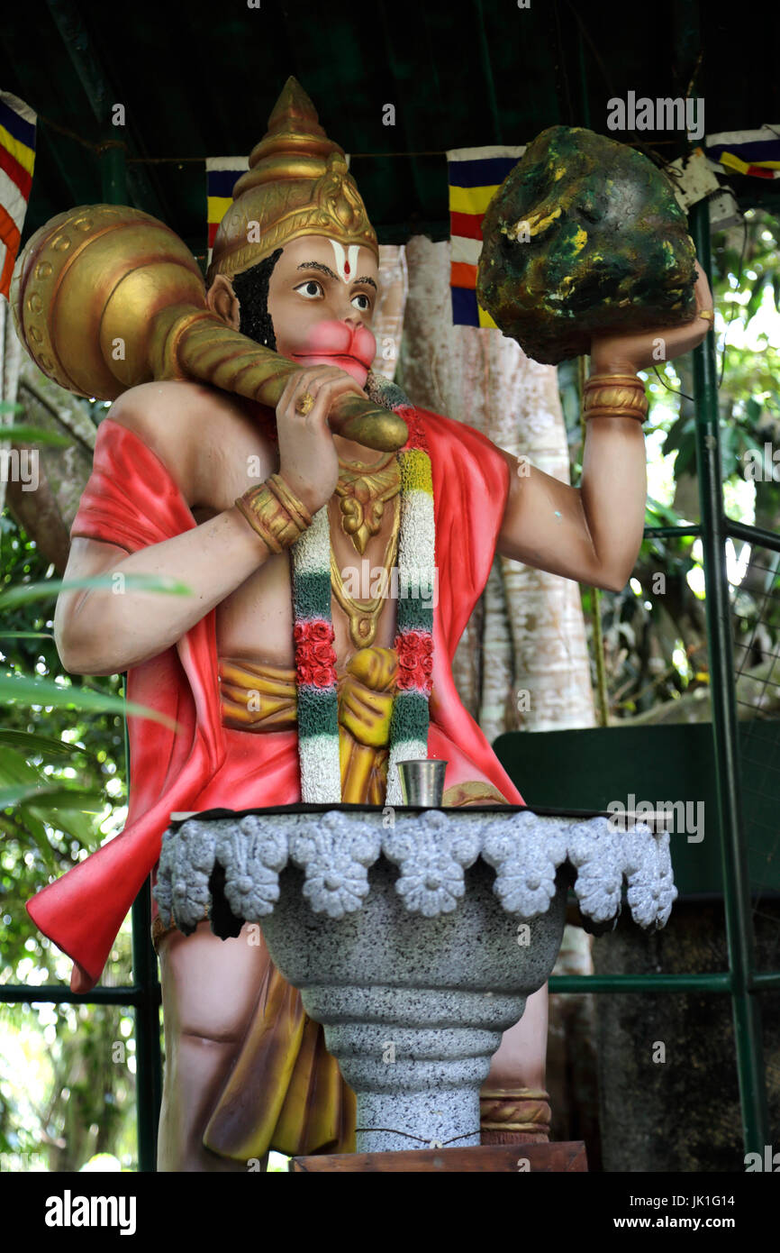 Galle Sri Lanka Rumassala Road Sri Vivekaramaya Temple Statue Of God Hanuman  holding the Gada and the Mountain Dronagiri Parvat Stock Photo