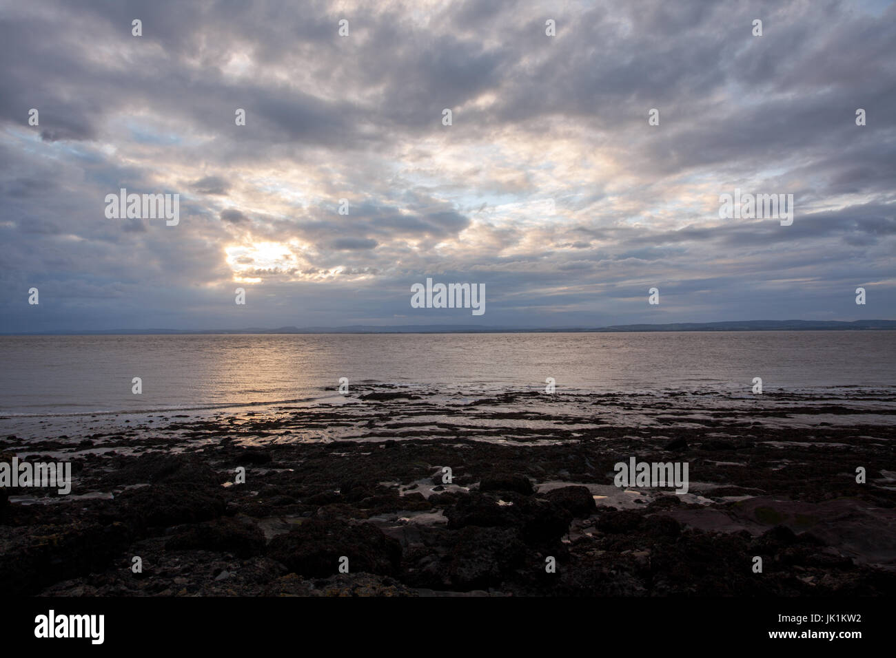 Moody sunset clouds over the Severn Estuary Stock Photo