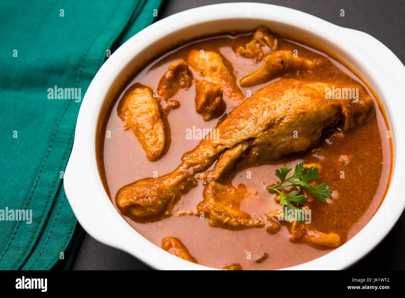 Indian spicy Chicken curry or masala chicken with prominent leg piece