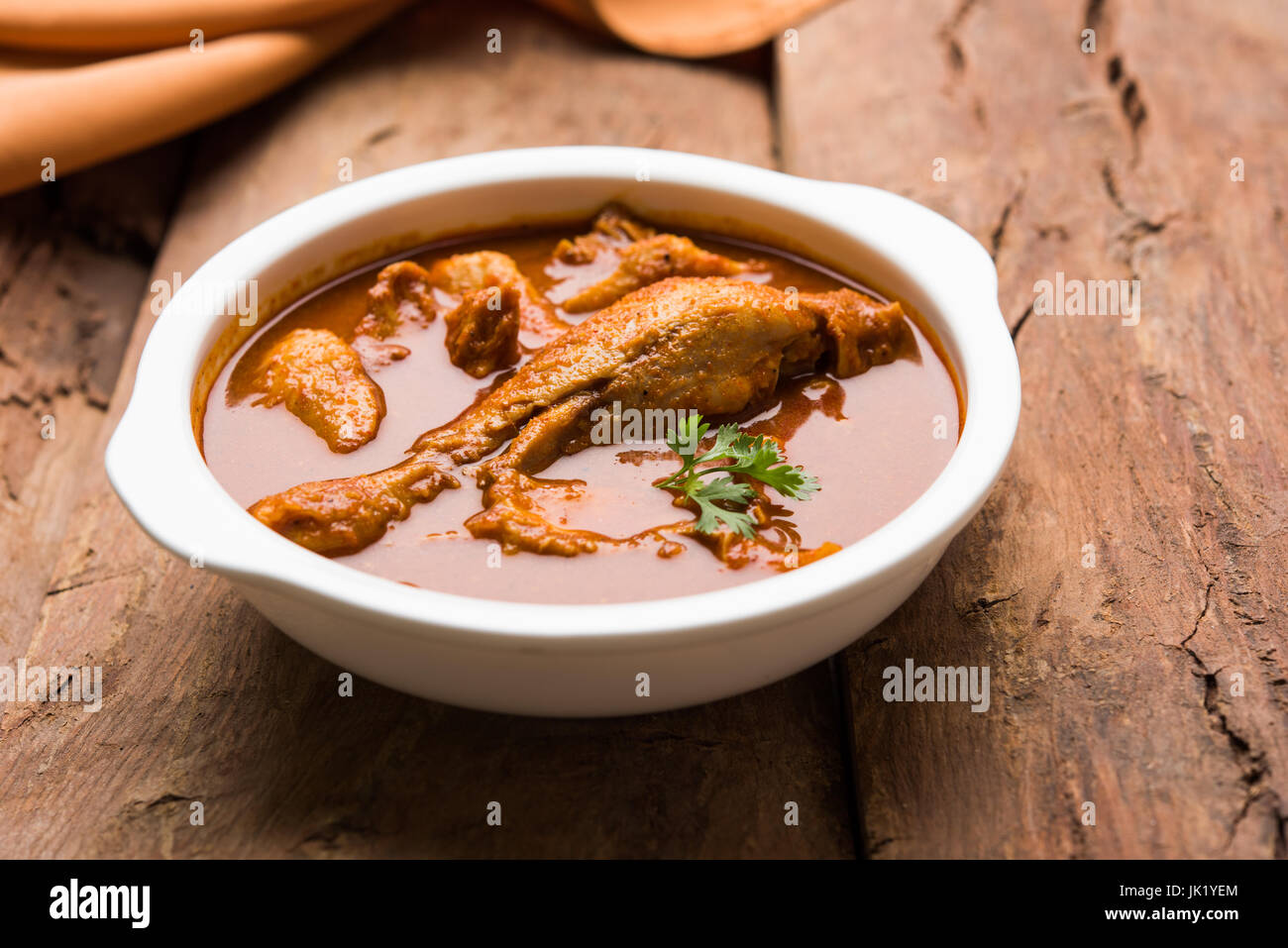 Indian spicy Chicken curry or masala chicken with prominent leg piece