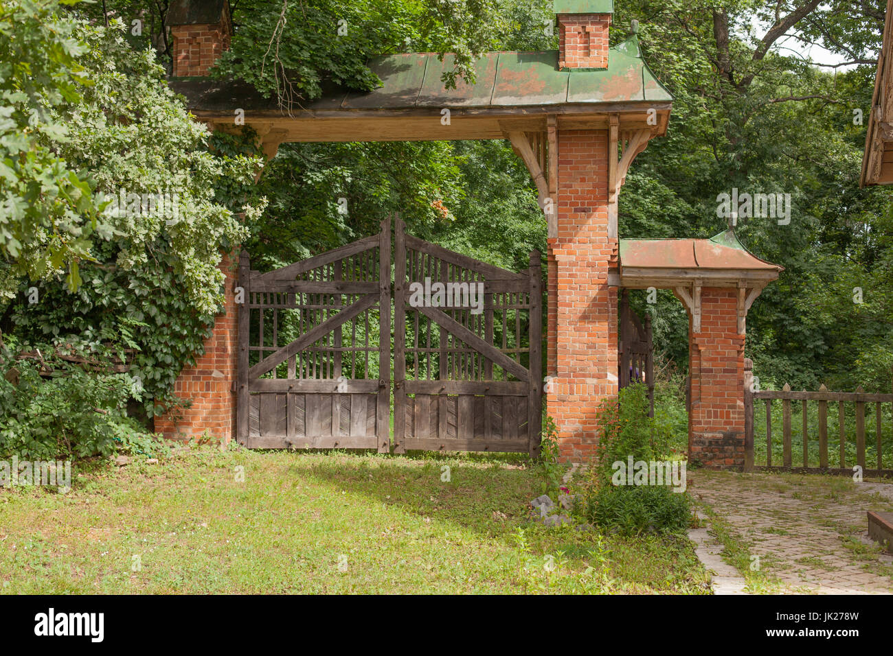 Wooden vintage antique gate and brick columns Stock Photo Alamy