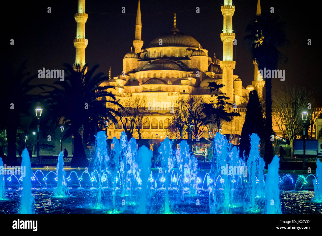 The Sultan Ahmed Mosque and fountain lit up in different colors at ...