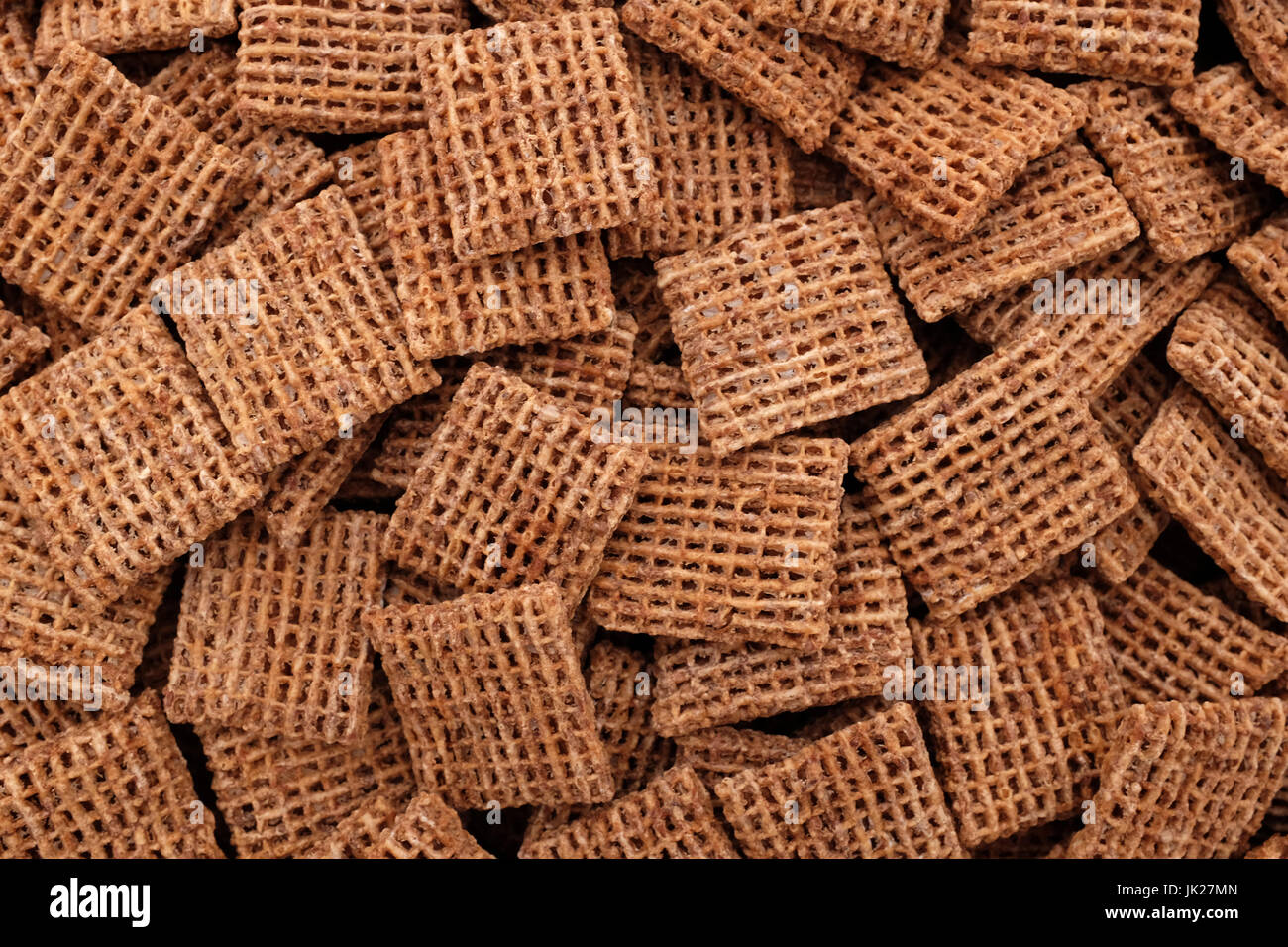 Malted wheat biscuits breakfast cereal as an abstract background texture - close detail Stock Photo
