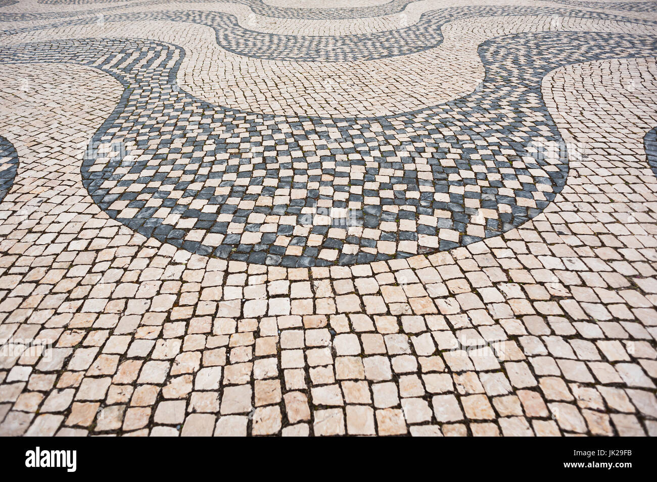 Traditional Portuguese pavement (cobblestone), Lisbon, Portugal Stock