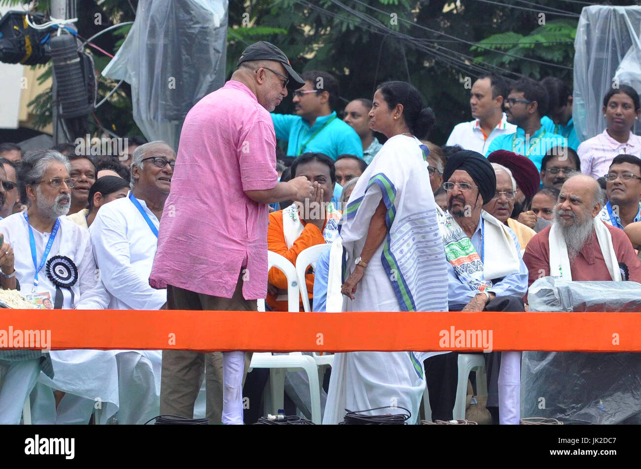 Trinamool Congress Supremo Mamata Banerjee (in right) talks with Kabir Suman (in left) the occasion of T.M.C. Martyrs Days rally in Kolkata.Under leadership of West Bengal Chief Minister and All India Trinamool Congress Supremo Mamata Banerjee TMC along with leaders and supporter from all around the country gathers to observe their Martyrs Day rally in front of Victoria House on July 21, 2017 in Kolkata. The 21 July Martyrs Day rally is annual mass rally organized by All India Trinamool Congress to commemorate the 1993 Kolkata firing where 13 people shot by police during the rally organized by Stock Photo