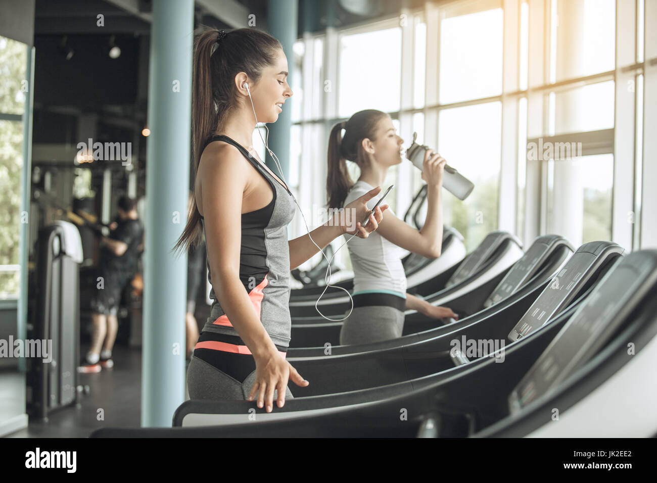 Young female friends exercise in the gym cardio Stock Photo