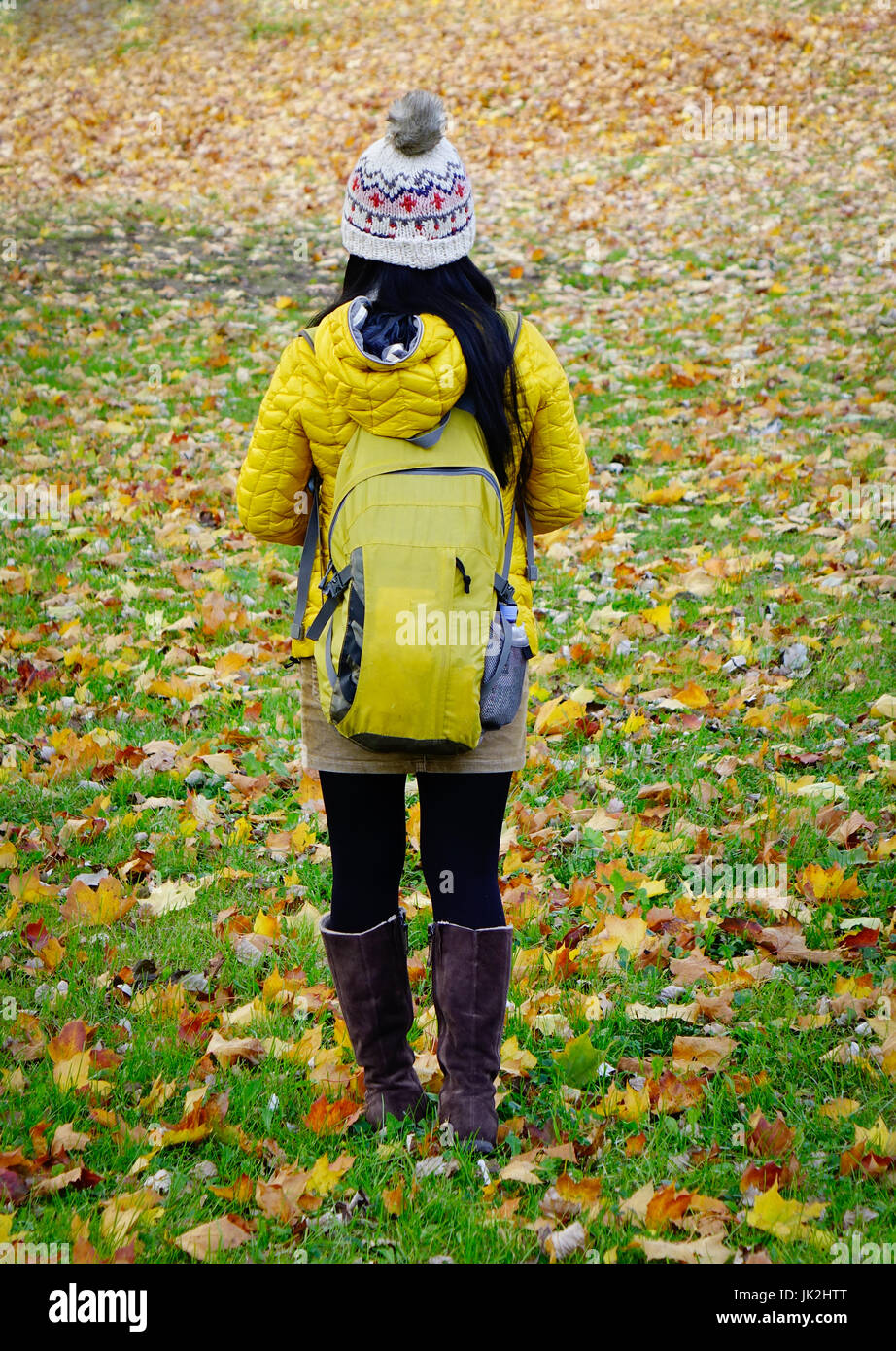 A woman walking at the park in autumn Stock Photo - Alamy
