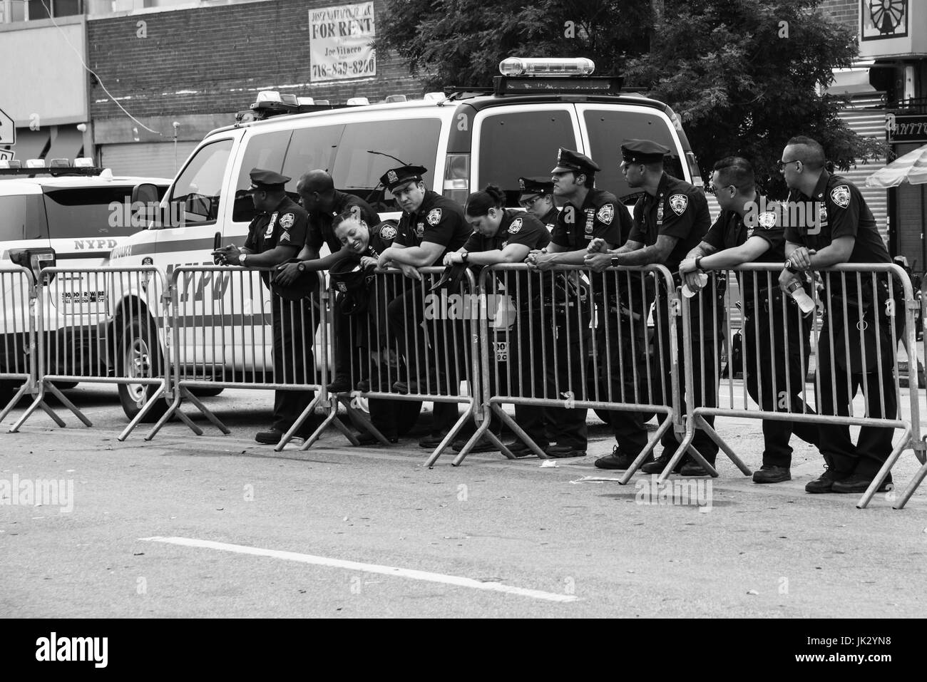 NEW YORK CITY - June 17, 2017: Police officers working during the 35th Annual Mermaid Parade in Coney Island. Stock Photo